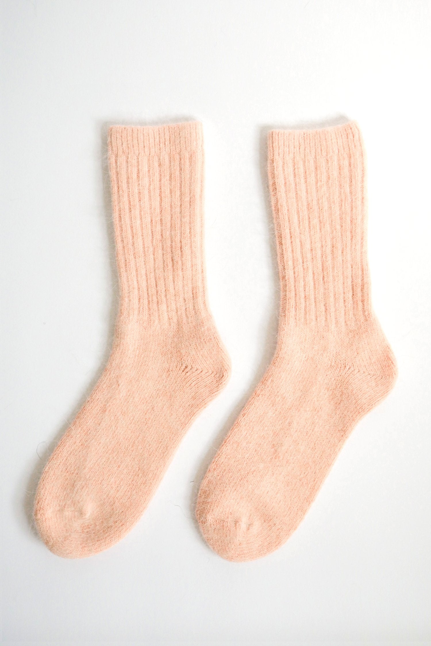 Skies For Miles soft Angora wool socks in peach color