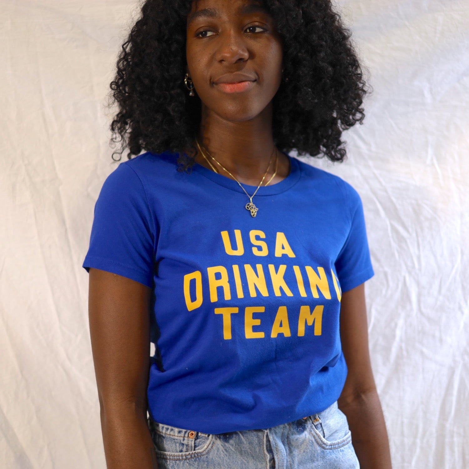 Slim fitted tee in blue with gold graphic USA Drinking Team 